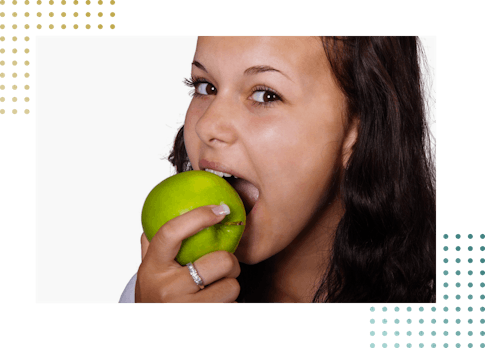 Girl bitting apple